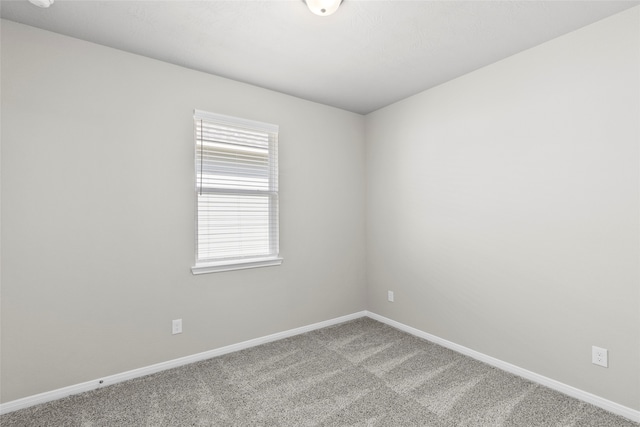 empty room with carpet flooring