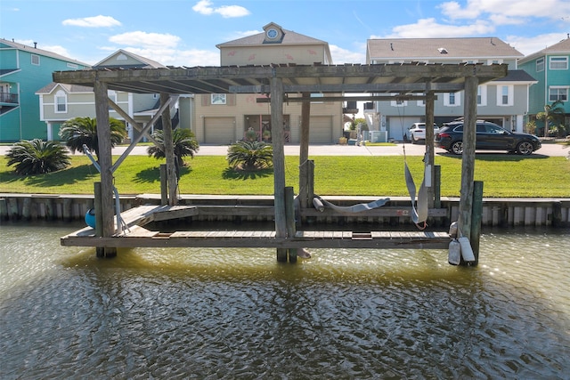 view of dock featuring a lawn and a water view