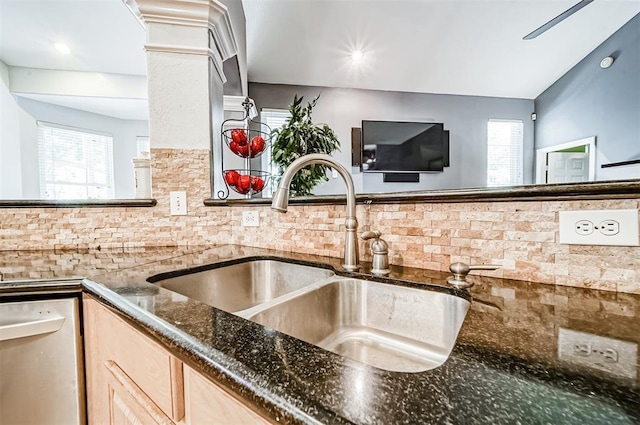 kitchen featuring decorative backsplash, light brown cabinets, sink, and a wealth of natural light