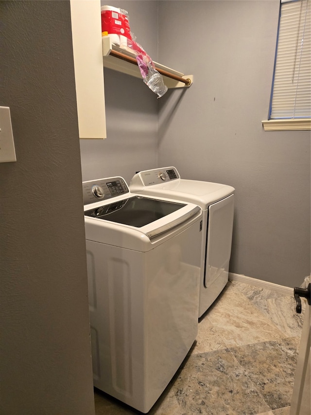 laundry room with washer and clothes dryer