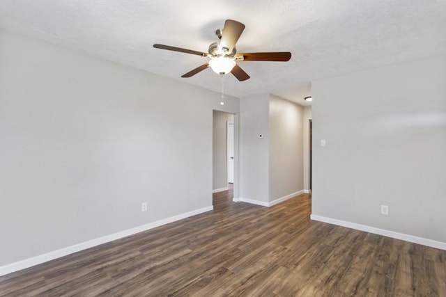 13210 Rockglen St, Houston, TX 77015 - empty room with dark wood finished floors and ceiling fan
