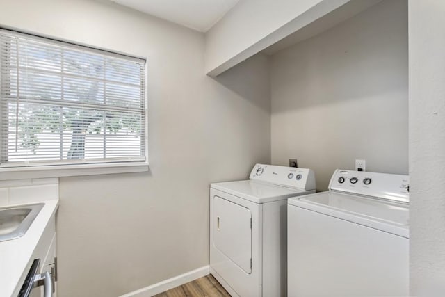 13210 Rockglen St, Houston, TX 77015 - laundry room with washer and dryer and light wood-style flooring