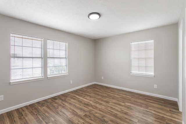 13210 Rockglen St, Houston, TX 77015 - spare room with dark wood finished floors