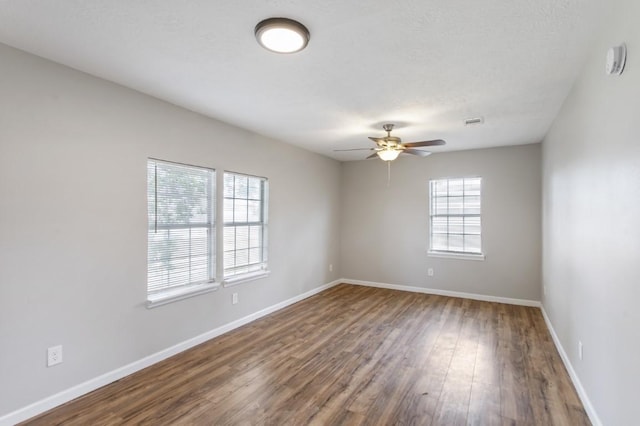 13210 Rockglen St, Houston, TX 77015 - empty room with wood finished floors, a ceiling fan, and a smoke detector