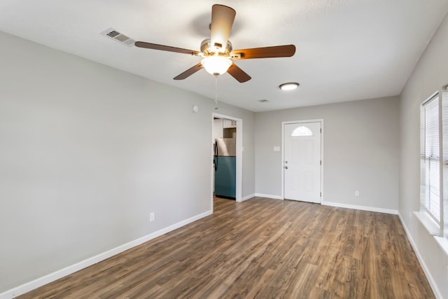 unfurnished room featuring dark hardwood / wood-style floors and ceiling fan