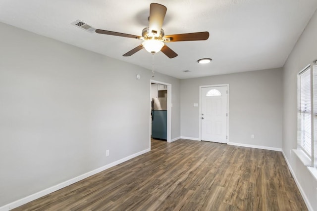 13210 Rockglen St, Houston, TX 77015 - spare room featuring dark wood-style flooring, a ceiling fan, and plenty of natural light