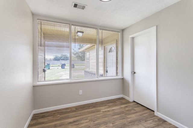13210 Rockglen St, Houston, TX 77015 - unfurnished room with healthy amount of natural light and wood finished floors