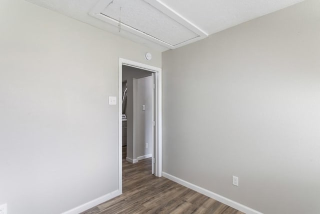 13210 Rockglen St, Houston, TX 77015 - empty room with attic access and wood finished floors
