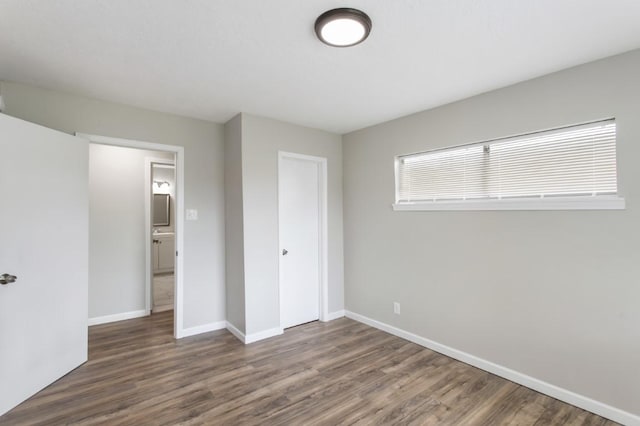 13210 Rockglen St, Houston, TX 77015 - unfurnished bedroom with wood finished floors and a closet