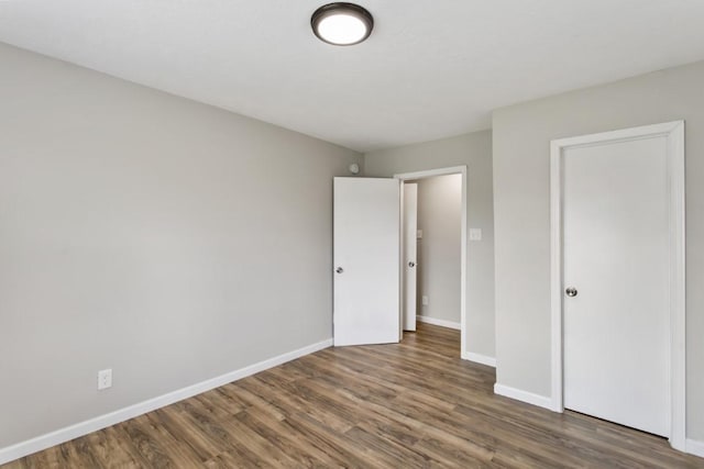 13210 Rockglen St, Houston, TX 77015 - unfurnished bedroom featuring wood finished floors and baseboards