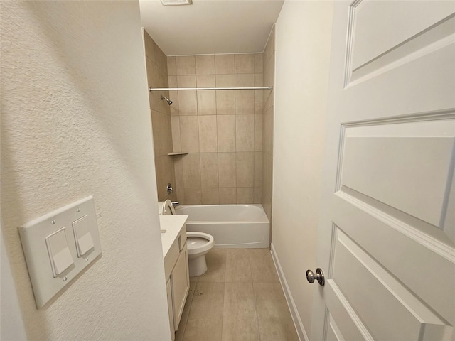 full bathroom with vanity, tiled shower / bath combo, and toilet