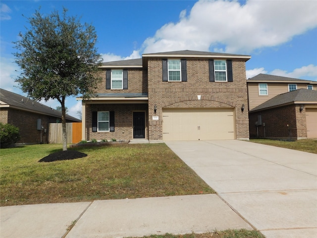 view of front facade with a front yard and a garage