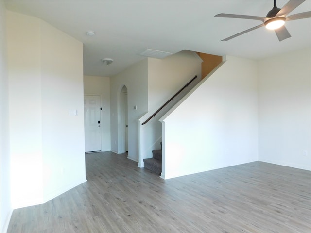 spare room with light hardwood / wood-style floors and ceiling fan