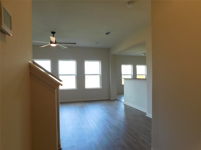 empty room featuring ceiling fan and wood-type flooring