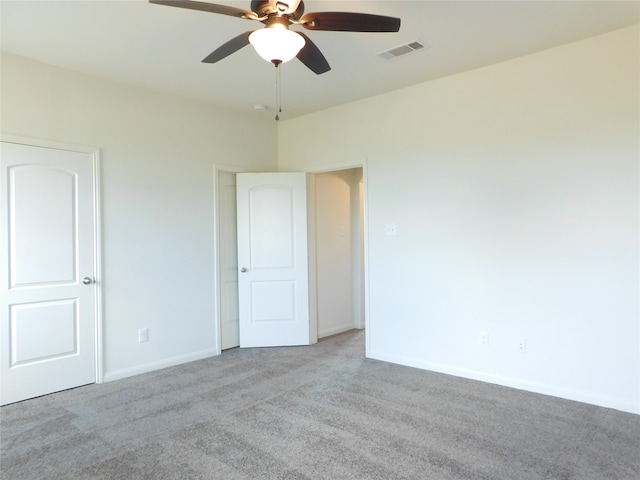 carpeted empty room with ceiling fan