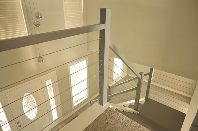 staircase featuring a wealth of natural light