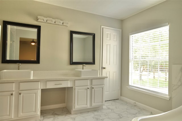 bathroom with vanity and plenty of natural light