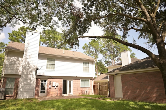 back of house with a patio area