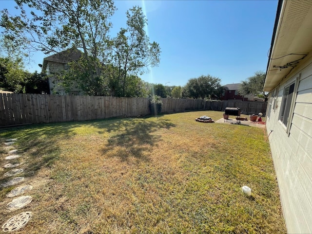 view of yard with a patio area and a fire pit