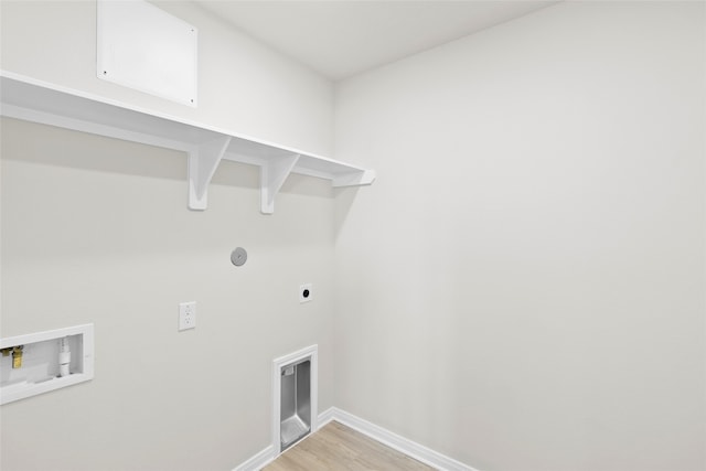 laundry area with hookup for a washing machine, electric dryer hookup, and wood-type flooring