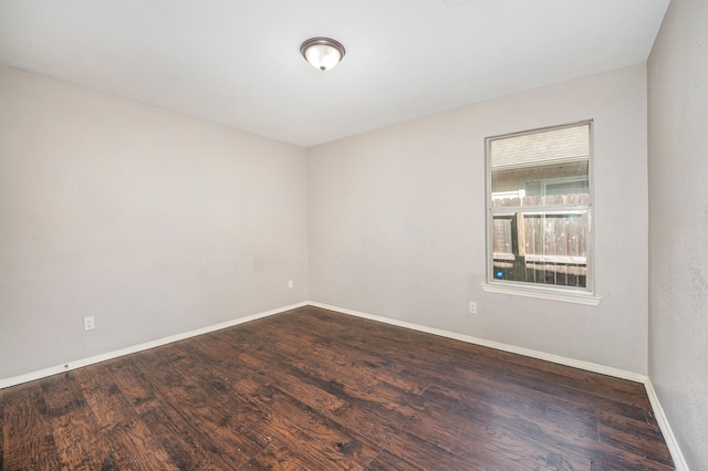 empty room featuring dark hardwood / wood-style floors