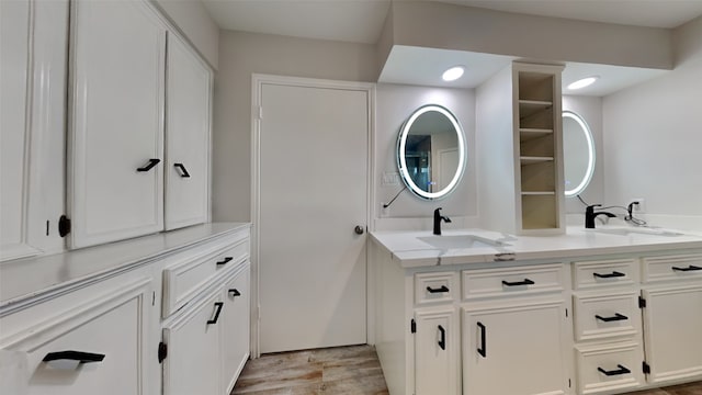 bathroom featuring vanity and wood-type flooring