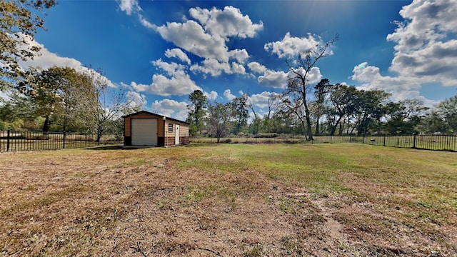 view of yard featuring a rural view and a storage unit