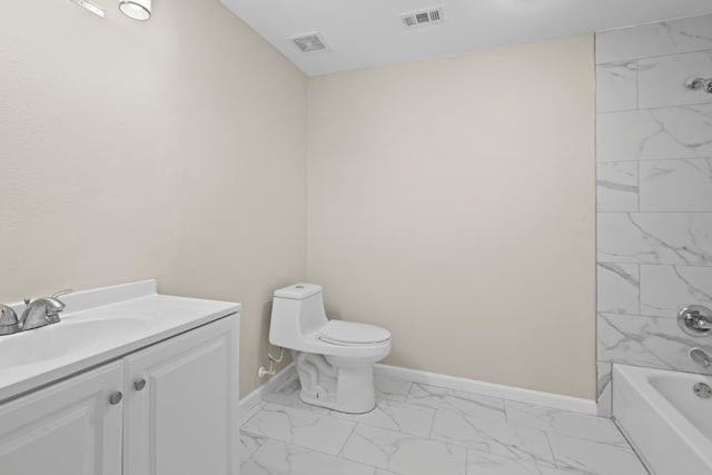 full bathroom with toilet, tiled shower / bath, and vanity