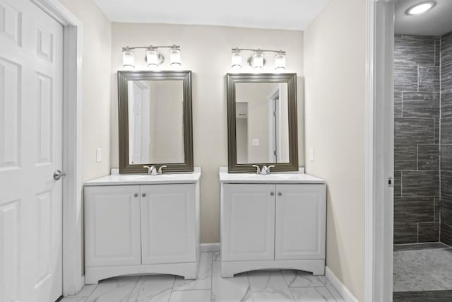1504 Maiden Ln, Richmond, TX 77469 - full bathroom with marble finish floors, two vanities, tiled shower, and baseboards