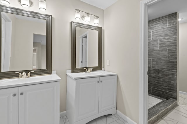 bathroom featuring vanity and a tile shower