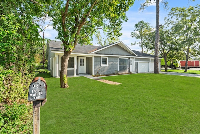 single story home featuring a garage and a front lawn