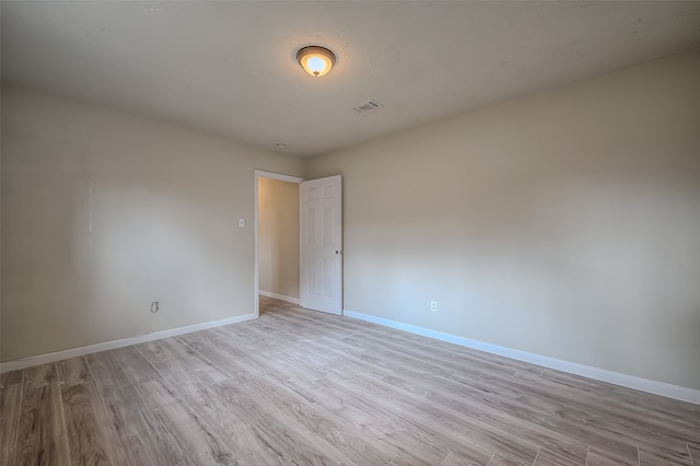 unfurnished room featuring light hardwood / wood-style flooring