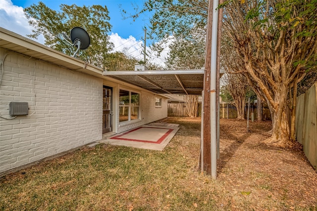 view of yard with a patio area