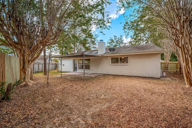 rear view of property featuring a patio