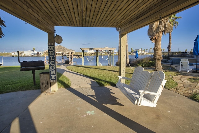 view of patio featuring a water view