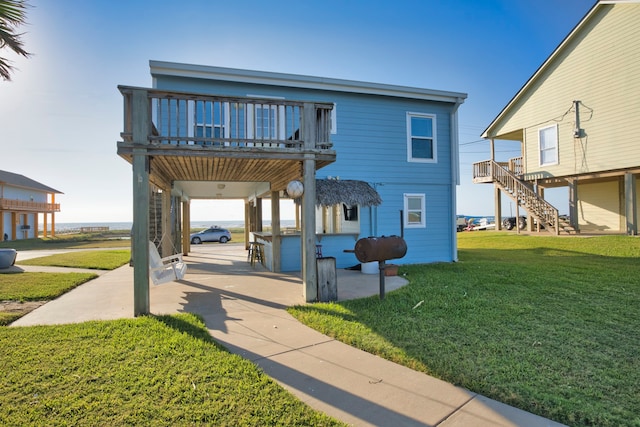 view of property with a front yard and a carport