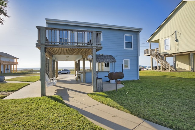 exterior space with a lawn, stairs, and a patio area