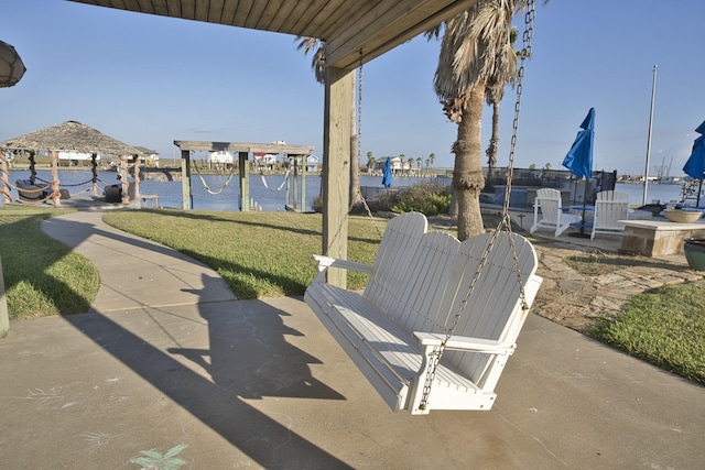 view of patio / terrace with a water view and a gazebo