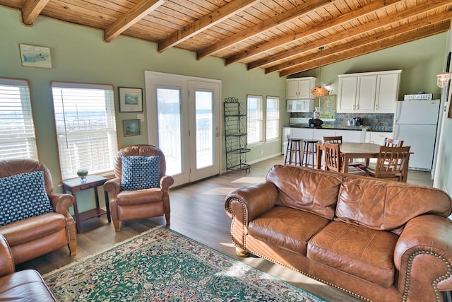 living room featuring vaulted ceiling with beams, wooden ceiling, and light wood-type flooring