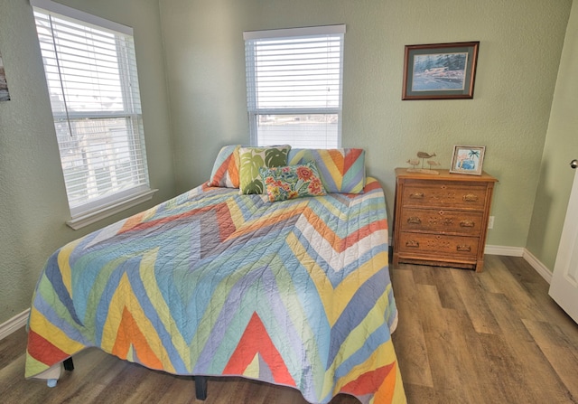 bedroom featuring wood-type flooring