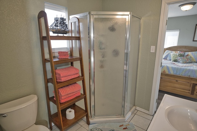 full bath with a shower stall, a textured wall, and ensuite bath