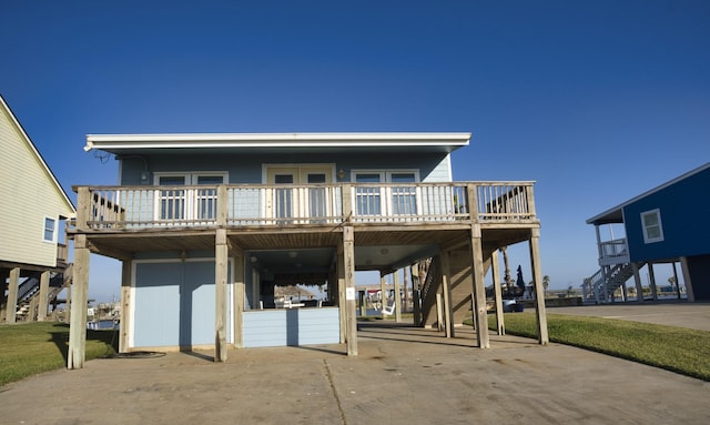 view of front facade with stairway, a carport, and driveway