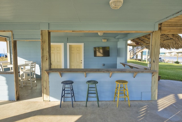 view of patio / terrace featuring outdoor dry bar