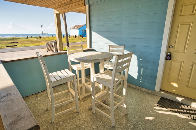 view of patio with a water view