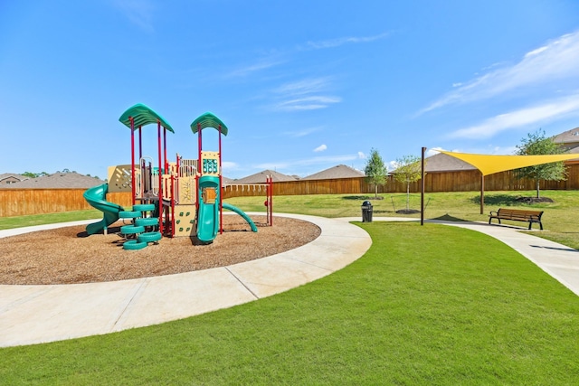 view of jungle gym featuring a lawn