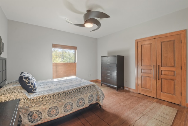 bedroom featuring hardwood / wood-style floors and ceiling fan