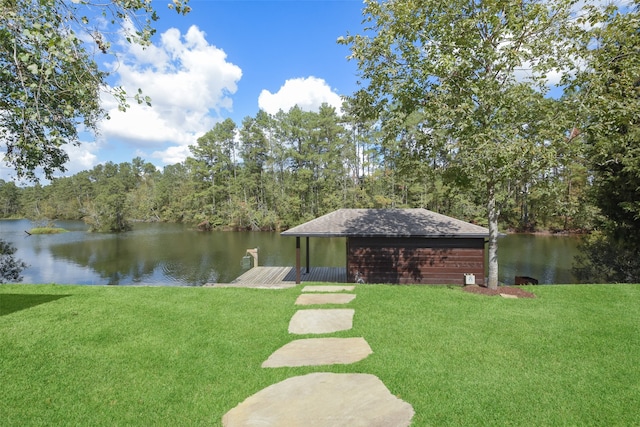 dock area with a water view and a yard