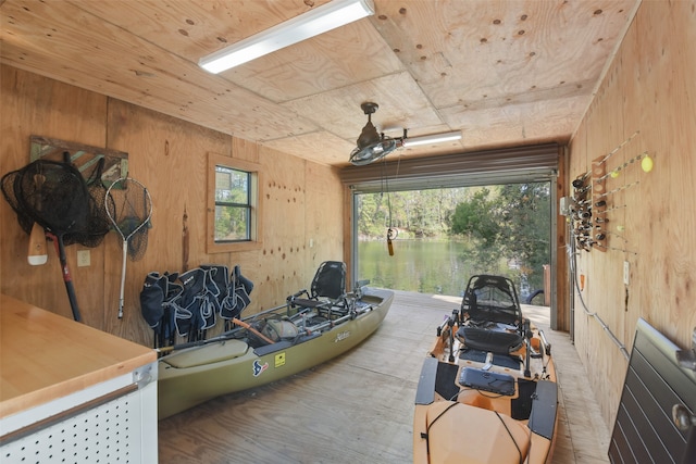 garage featuring wood walls