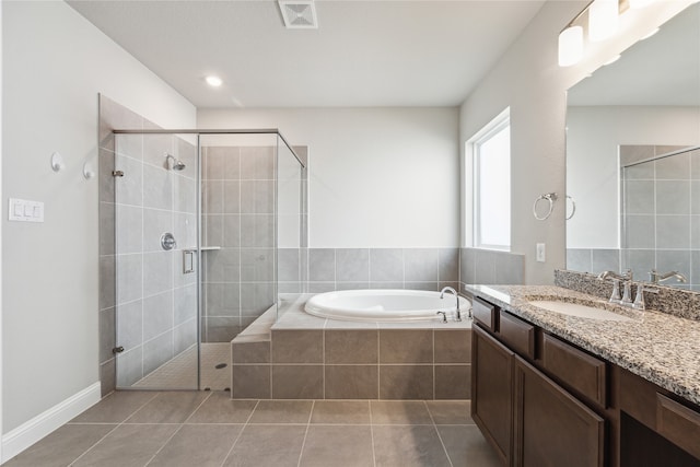 bathroom featuring vanity, separate shower and tub, and tile patterned flooring