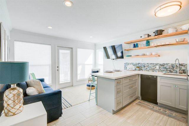 kitchen featuring kitchen peninsula, dishwasher, gray cabinets, crown molding, and sink